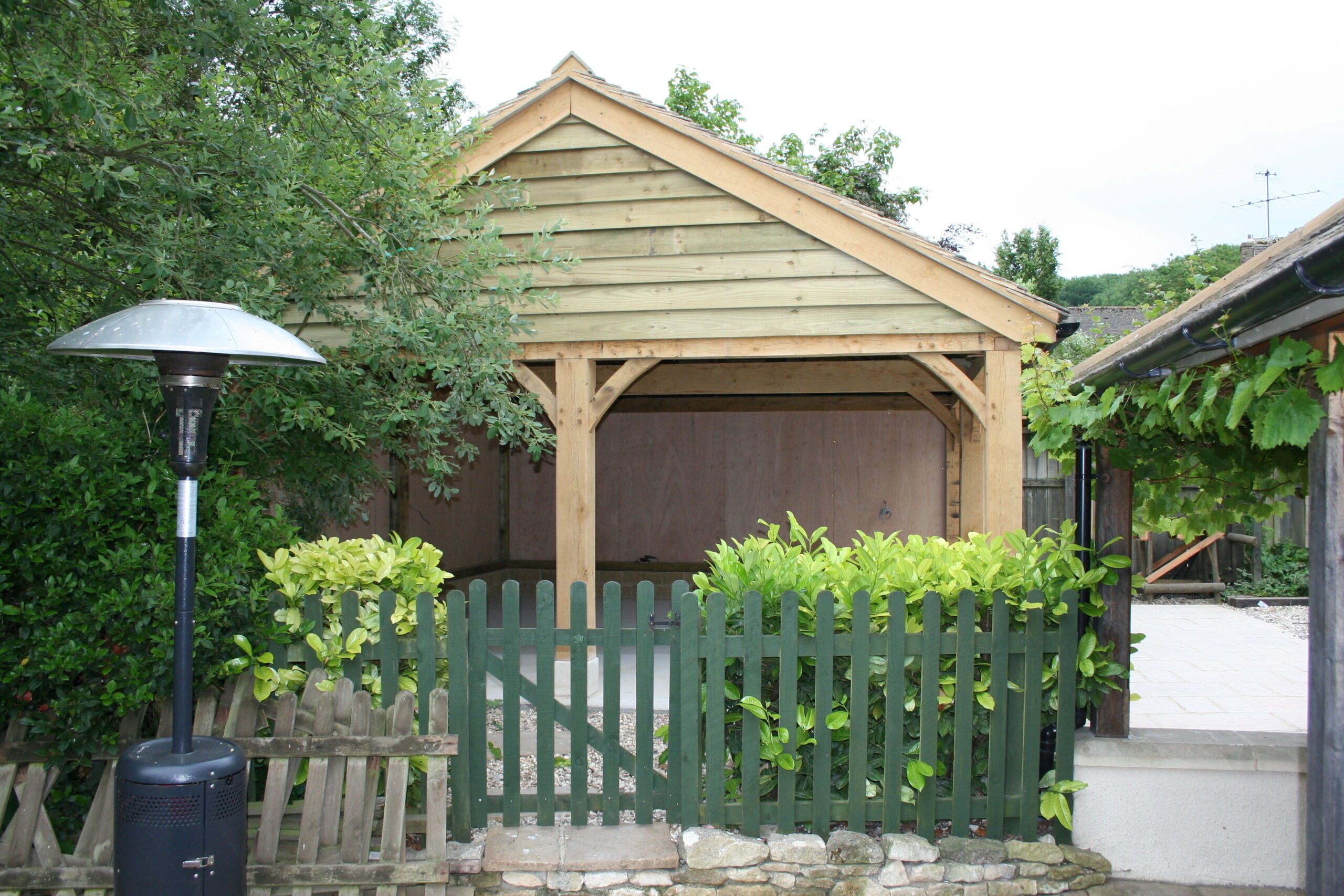 image showing an Oak framed single carport and garage