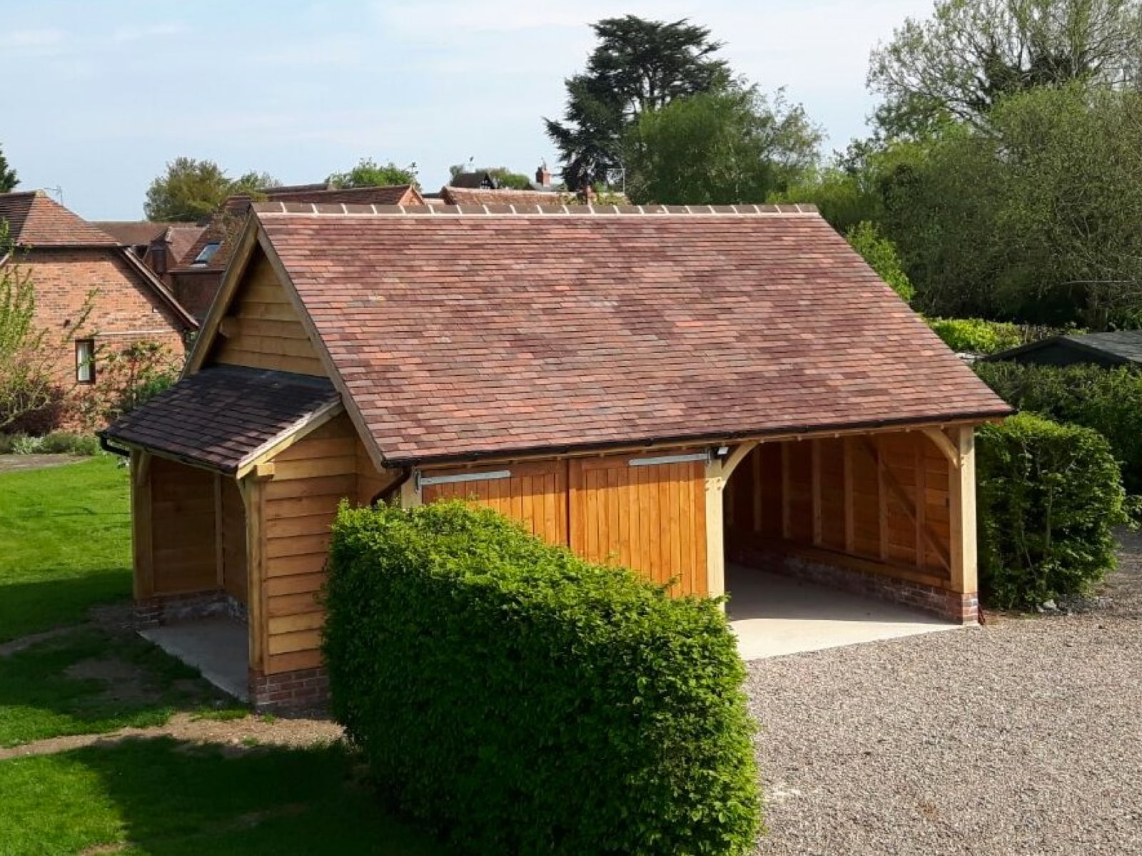 image showing an Oak framed single carport and garage